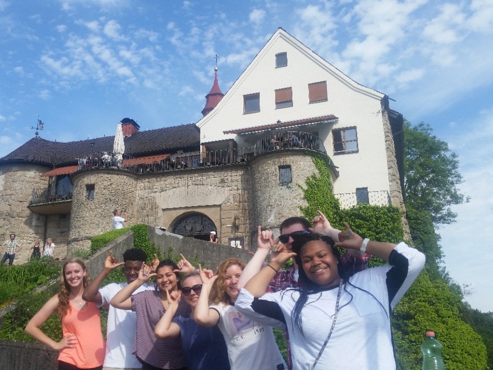 Student working on campus stairs