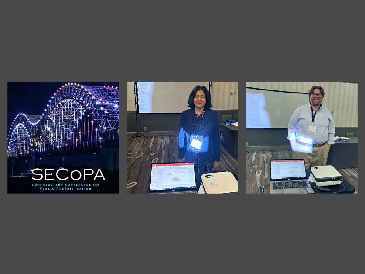 Drs. Ahmed and Wilson standing in room for presentations