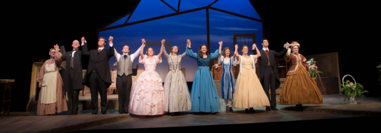 Theater students taking a bow during a production